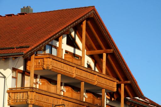 A closeup shot of a wooden house on a sunny day