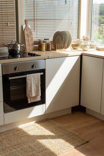 A vertical shot of a cozy interior of a modern kitchen