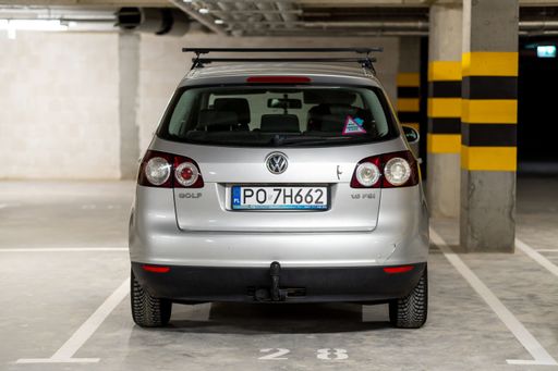 A parked Volkswagen Golf Plus car from the back in a parking garage