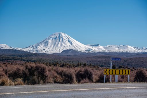 Mt Ngauruhoe in new Zealand with SH1 also called the Desert Road in foreground with a road sign