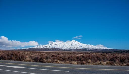 Mt Ruapehu with desert road and the central plateau in foreground. Winter snow coat the mountain