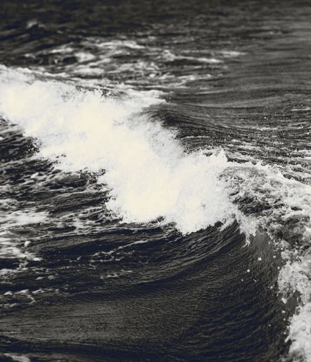 A grayscale shot of the waving ocean. Scandinavia