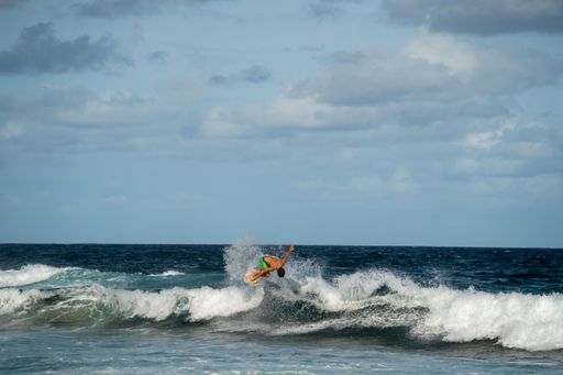 A surfer catching a wave at the beach on a sunny day at Manly Beach, Australia.
Good for backgrounds.