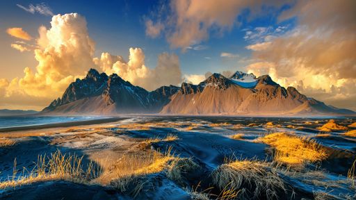 An aerial view of the beautiful Vestrahorn mountains in Stokksnes, Iceland during a dramatic sunset