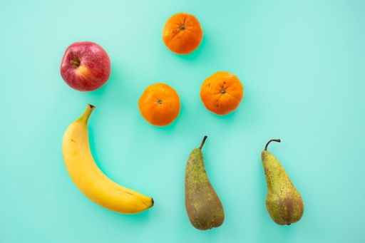 A delicious ripe fruits isolated on a blue background