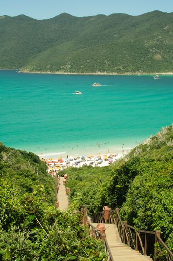 A vertical shot of Wooden stairs leading to Atalaya beach in Arraial do Cabo, Rio de Janeiro State