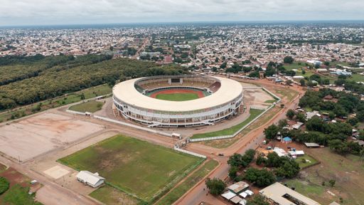 An aerial view of a football pitch in Ghana in cloudy sky background