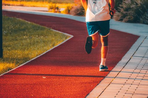 A person running in a park captured on a sunny day