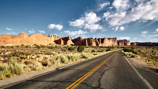 A beautiful scenery of a highway in a canyon landscape in Arches National Park, Utah - USA