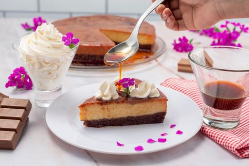 A closeup shot of a chocolate and flan dessert, inverted cake with chocolate sponge cake and milk flan