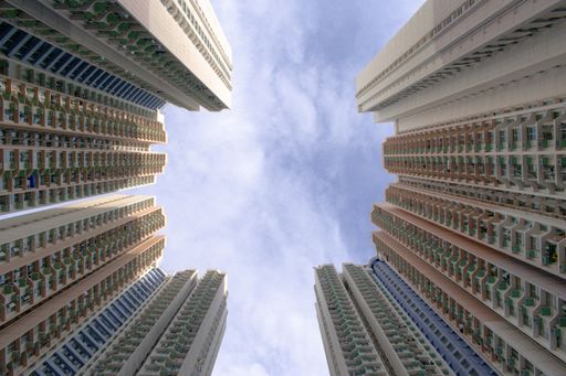 A low angle shot of high-rise downtown building towers in Hong Kong