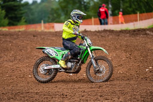 The racer on motocross along the dirt road at Latvian National Motocross Cup in Dobele