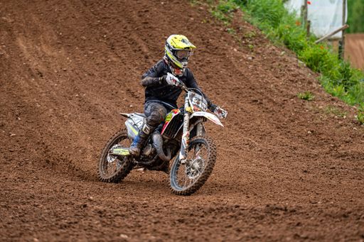 The racer on motocross along the dirt road at the "Donkey of the road" at Latvian National Motocross Cup in Dobele