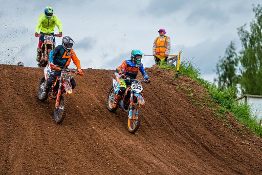 The racers on motocross along the dirt road at the "Donkey of the road" at Latvian National Motocross Cup in Dobele