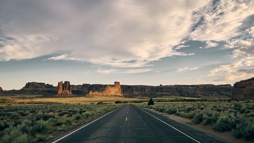 A beautiful scenery of a highway in a canyon landscape in Arches National Park, Utah - USA