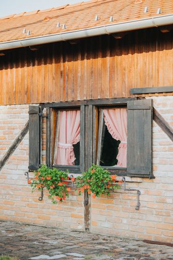 A vertical shot of a rural building's windows