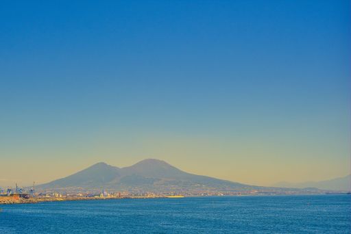The beautiful Vesuvius volcano in Naples with sea and mist in the foreground