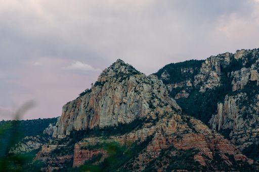 Sedona landscape of beautiful cliffs and vibrant clouds during warm summer sunset