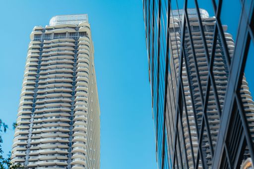 A low angle shot of buildings made of glass