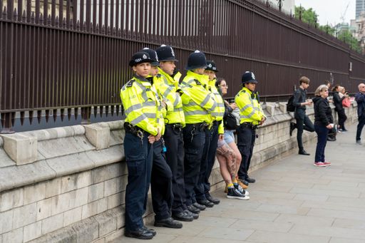 The police officers on duty in a city center during a special event. England, UK.