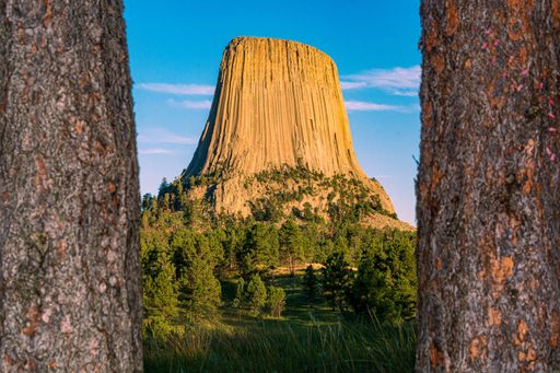 A beautiful shot of the Devils Tower National Monument in Wyoming against blue sky