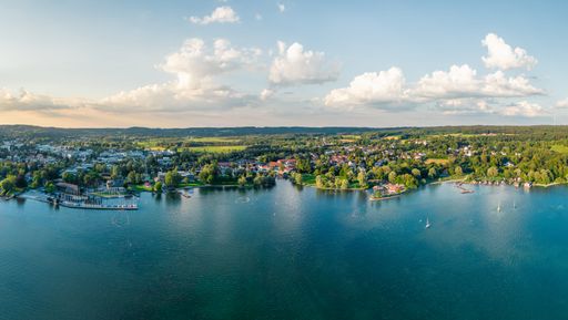 flying drone panorama of Starnberg, popular town,tourist resort and recreation area near munich. Lake Starnberg with sailboats and harbor