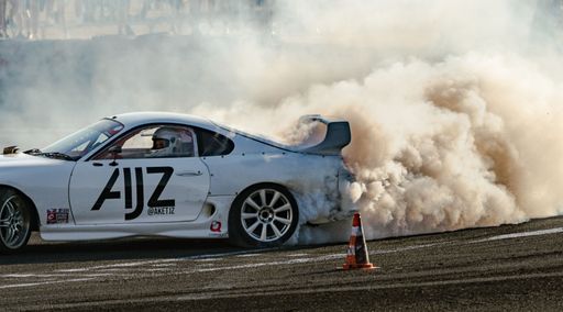 A Toyota Supra drifting on a dust during the event in Budapest, Hungary
