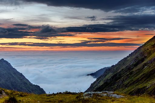 A scenic view of cloudscape seen from the mountain top in Romania