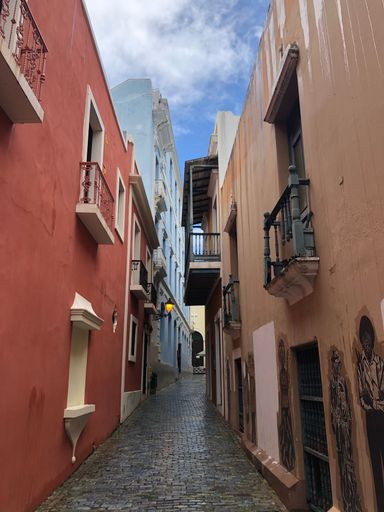 A vertical shot of an alleyway in downtown Old San Juan in Puerto Rico