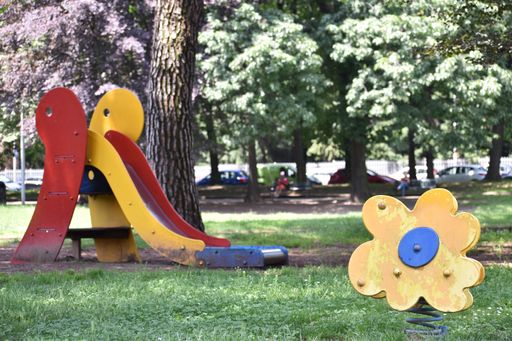 A closeup shot of a modern and colorful  slide in the park