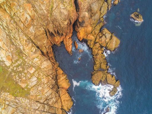 Rocky coast in Galicia. Cape Vilan lighthouse Area. Spain. Drone Photo .