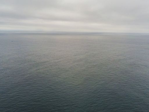 Rocky coast in Galicia. Cape Vilan lighthouse Area. Spain. Drone Photo .