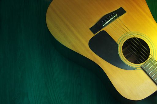 A close up shot of an acoustic guitar