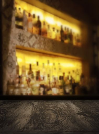 A close up shot of a table surface with a background of the blurred bar