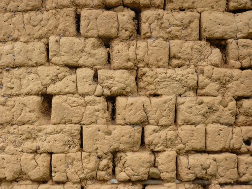A closeup shot of a wall made of mudbricks