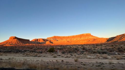 A beautiful landscape of canyons under a blue sky at sunset in Utah