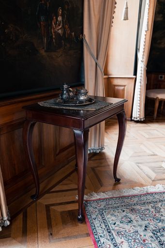 A vertical shot of a small Table with a tea set on it in Zofingen, Switzerland