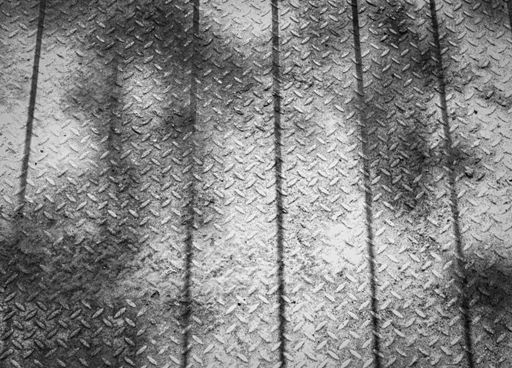 A grayscale shot of an industrial floor background