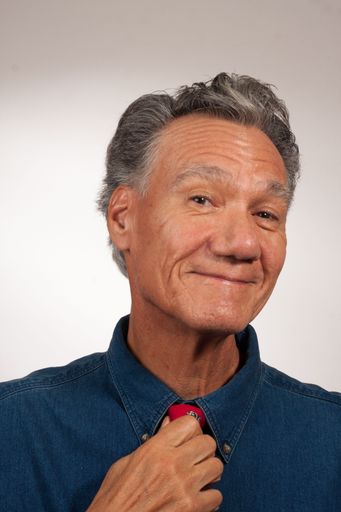 Happy mature man 60 plus adjusting his neck tie