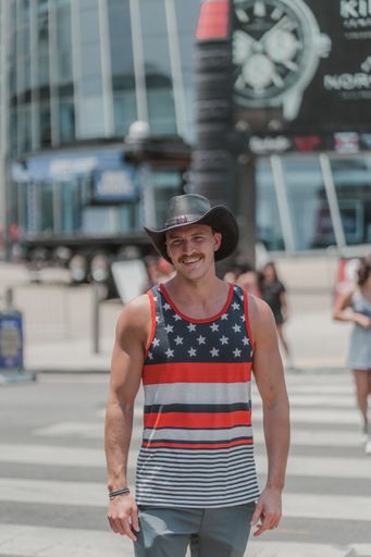 A vertical shot of people walking in the street during Independence Day in Nashville, USA