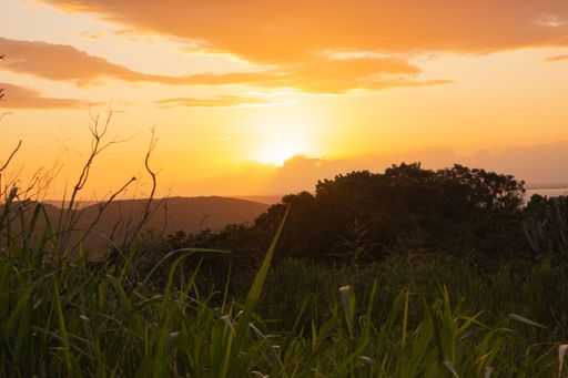 A mesmerizing view of a golden sunset over mountains