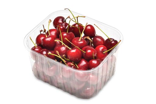 Cherries in plastic container isolated on white
