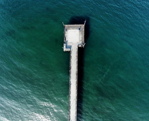 An aerial top view of the pear over the beach