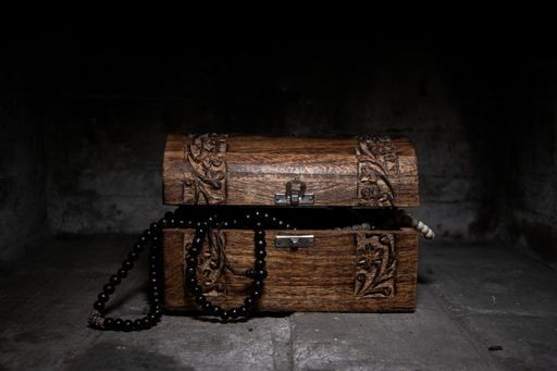 Dark image of a trunk with pirates treasures