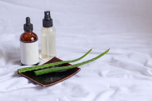 Product mockup of aloe vera spray and serum showing natural and eco-friendly beauty and body care product