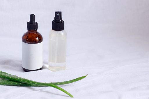 Product mockup of aloe vera spray and serum showing natural and eco-friendly beauty and body care product
