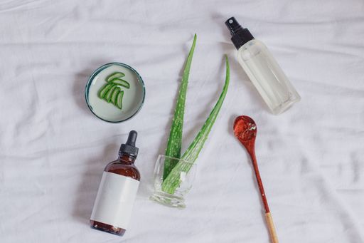 Product mockup of aloe vera spray and serum showing natural and eco-friendly beauty and body care product