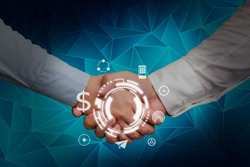 a photo of hands shaking and a hologram presenting innovative ideas and symbolizing teamwork.