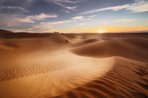 The magic of the sunset over Sahara dunes