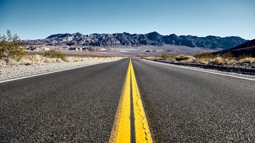 A sunny scenery of the CA190 highway in Death Valley National Park, California - USA